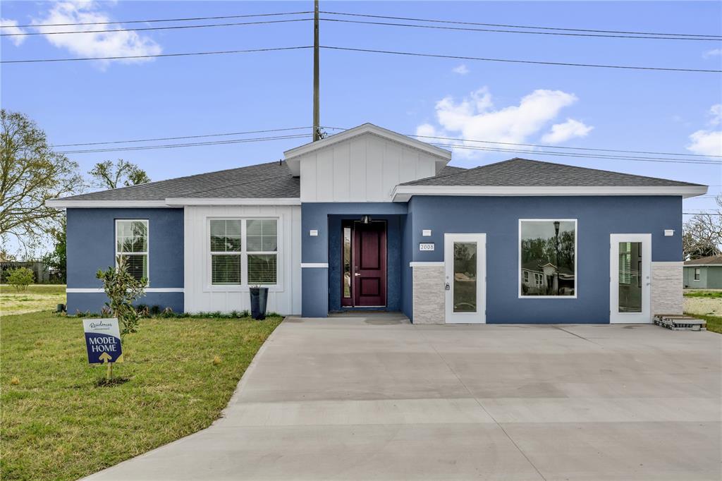 2008 River Hawk Loop Winter Haven, FL 33880 - Photo 4 of 37 a front view of a house with a yard and garage