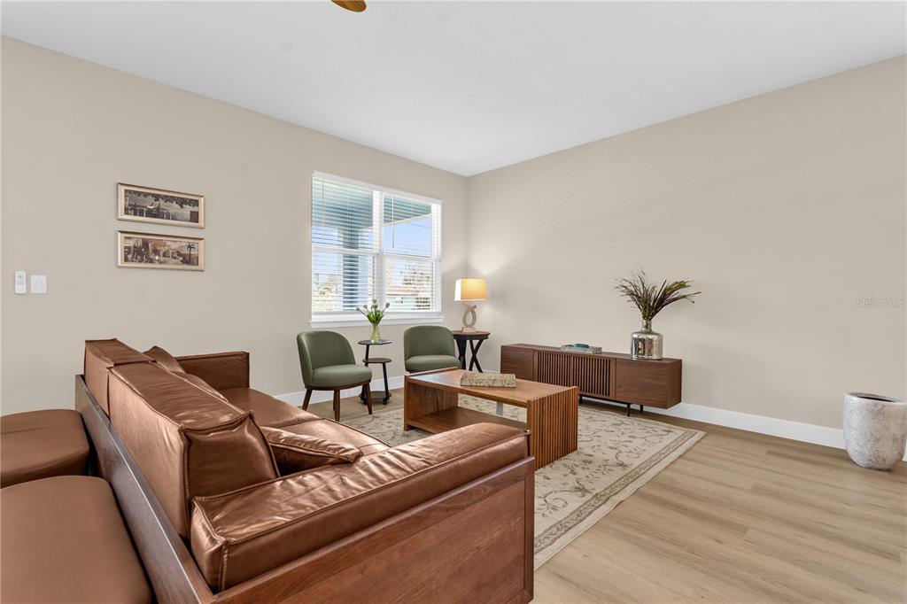 2008 River Hawk Loop Winter Haven, FL 33880 - Photo 6 of 37 a living room with furniture and a potted plant