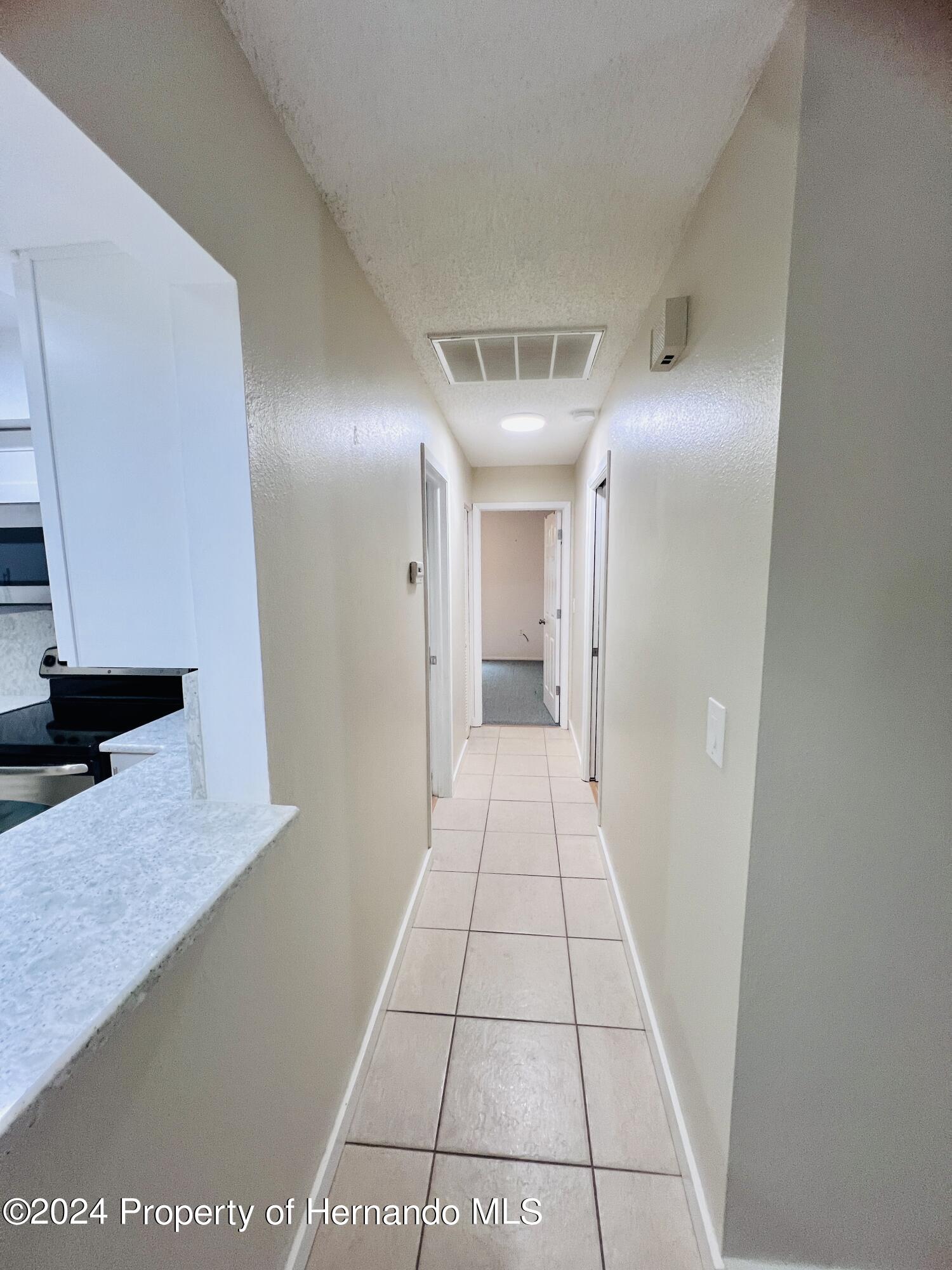 8141 Bugle Court Port Richey, FL 34668 - Photo 13 of 25 a view of a hallway