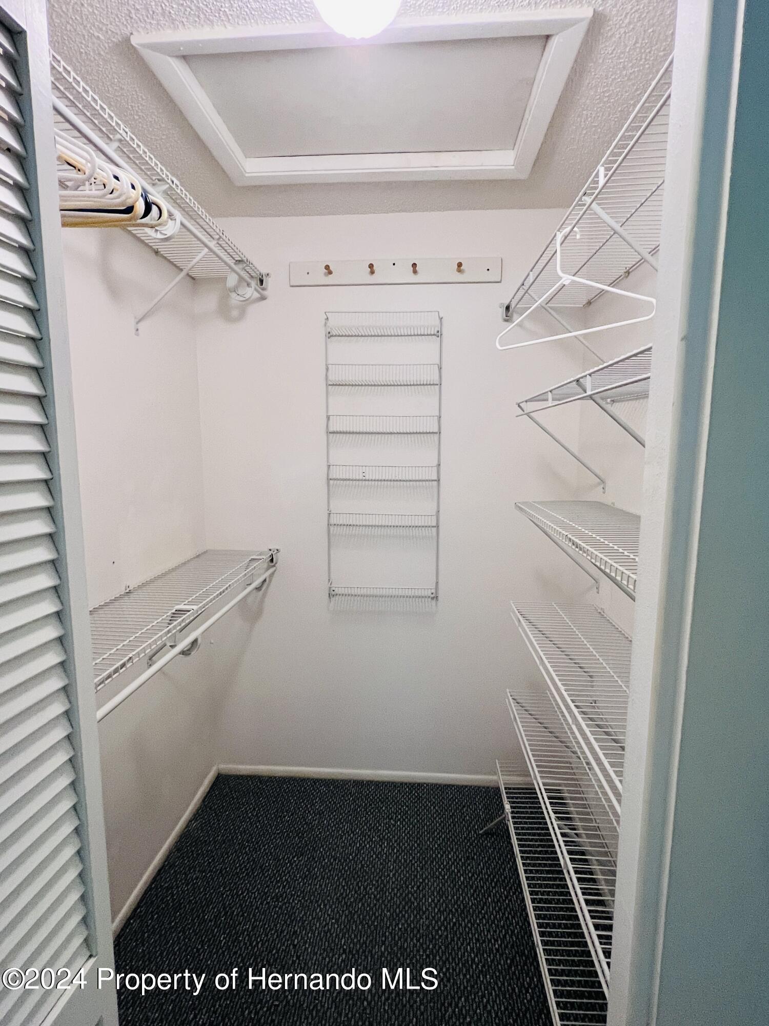 8141 Bugle Court Port Richey, FL 34668 - Photo 16 of 25 a view of walk in closet