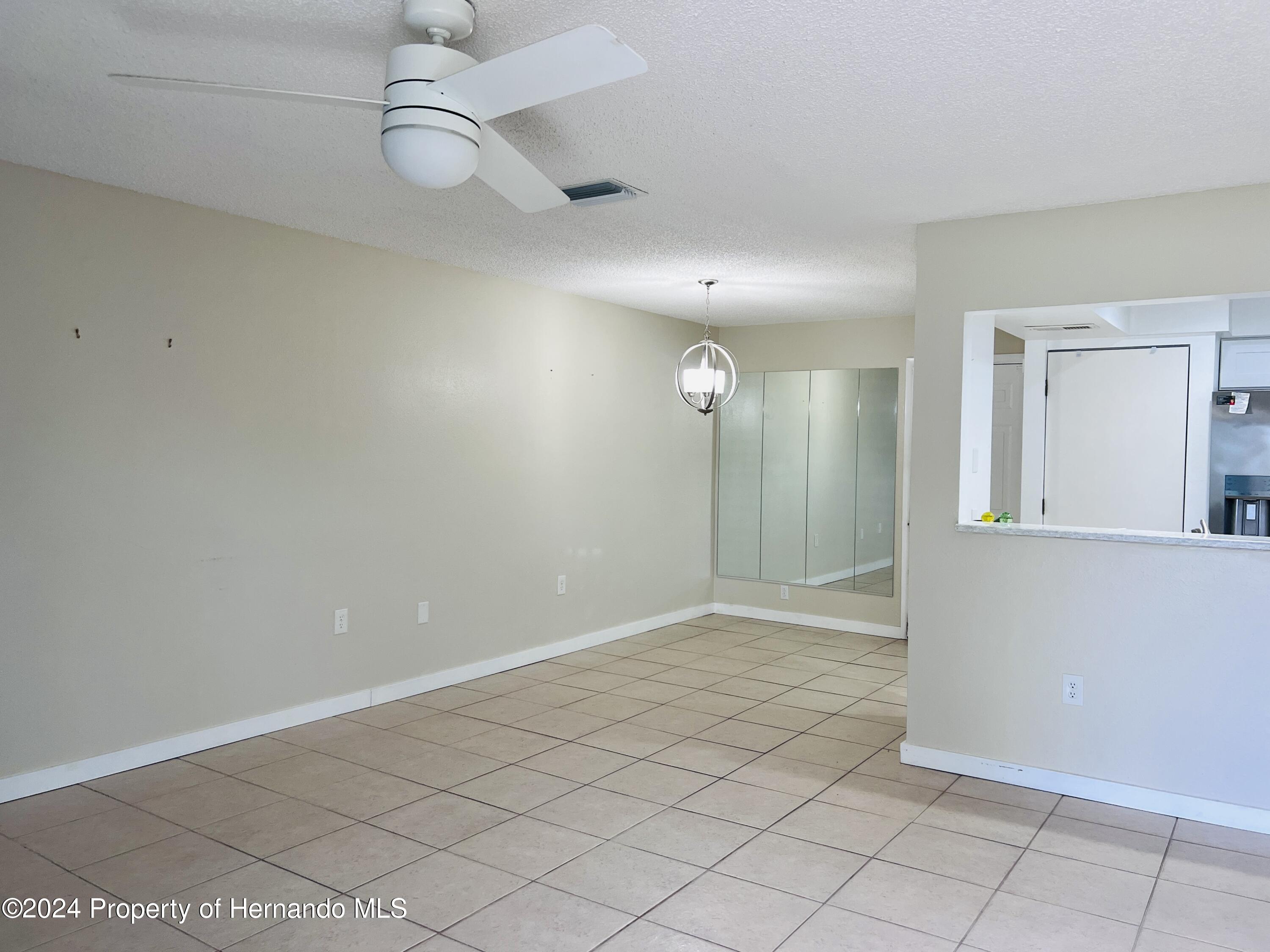 8141 Bugle Court Port Richey, FL 34668 - Photo 6 of 25 a view of an empty room