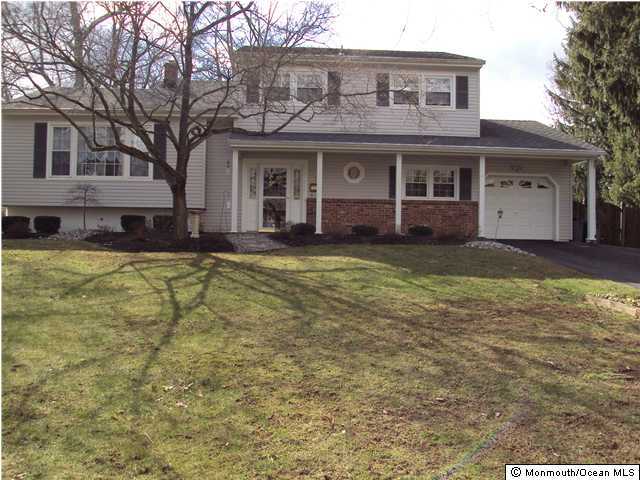 115 Jumping Brook Road Lincroft, NJ 07738 - Photo 1 of 3 a view of a yard in front of house