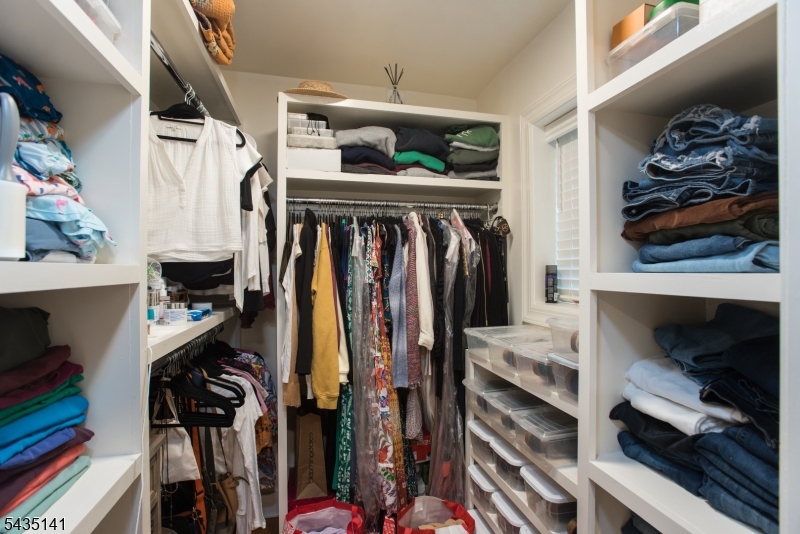 14 Locust Street Madison, NJ 07940 - Photo 9 of 33 a view of walk in closet with clothes and shoes