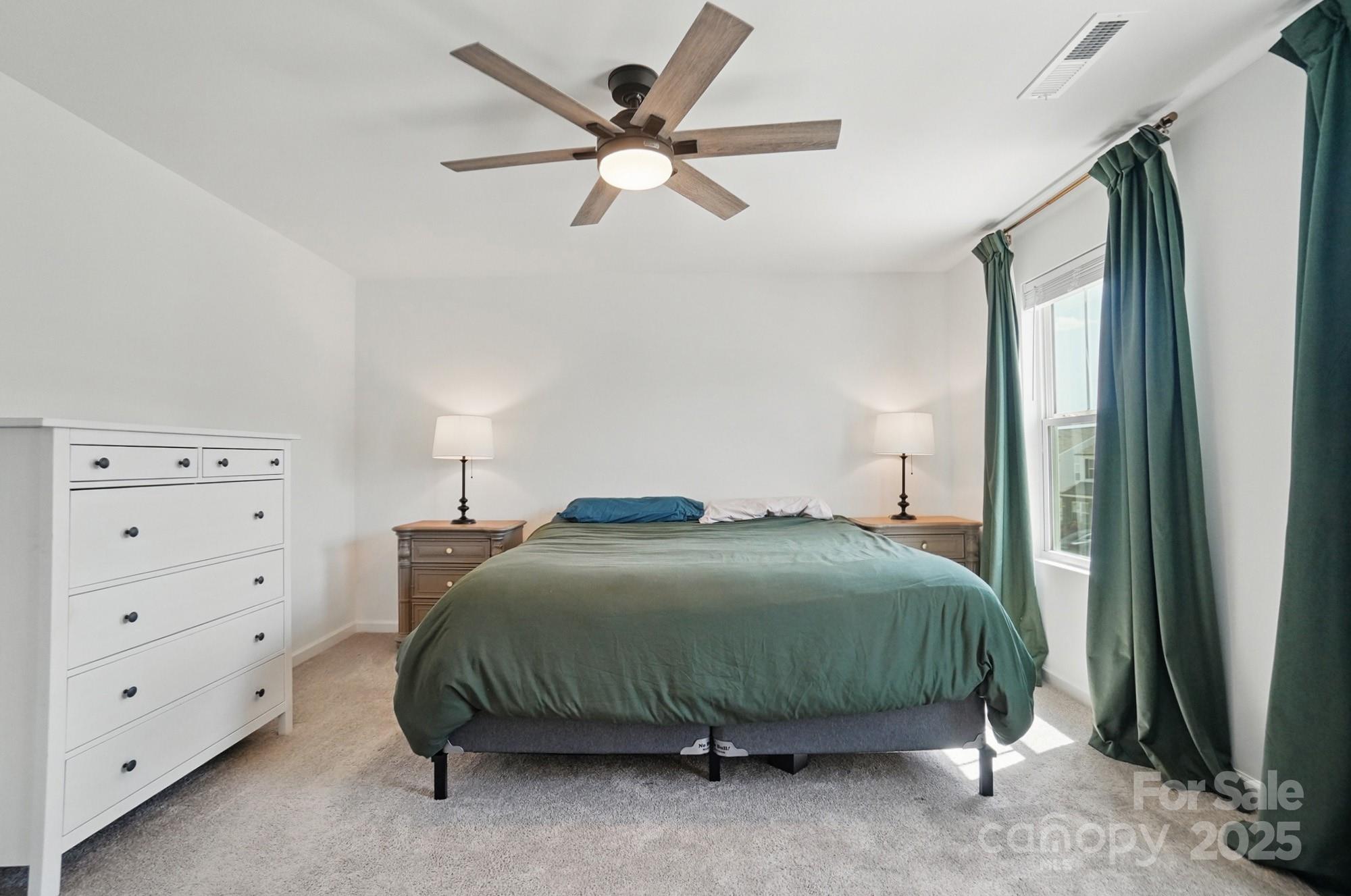637 Scotch Meadows Loop Monroe, NC 28110 - Photo 17 of 30 a bedroom with a bed and a cabinets