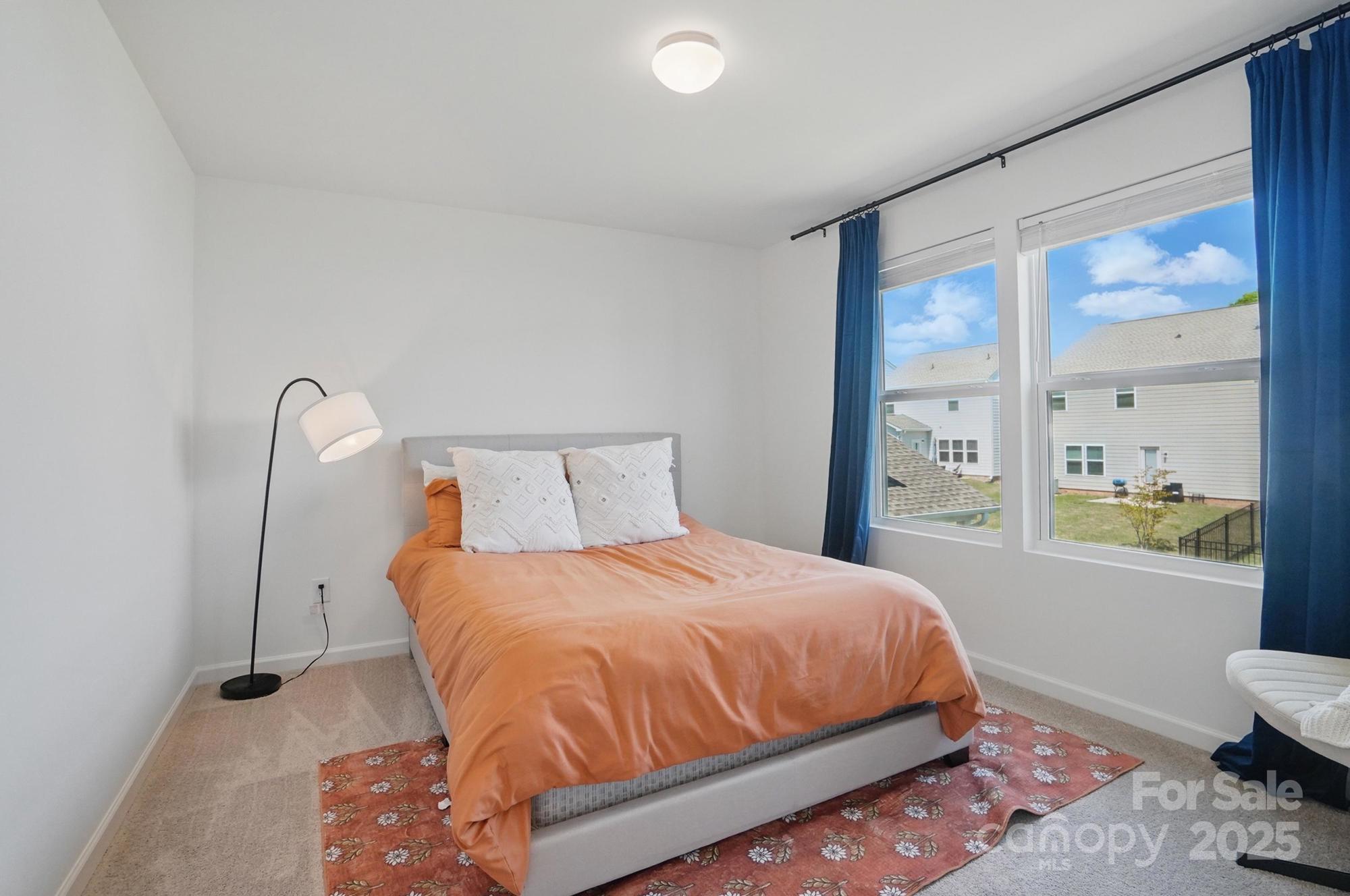 637 Scotch Meadows Loop Monroe, NC 28110 - Photo 22 of 30 a bedroom with a bed and a window
