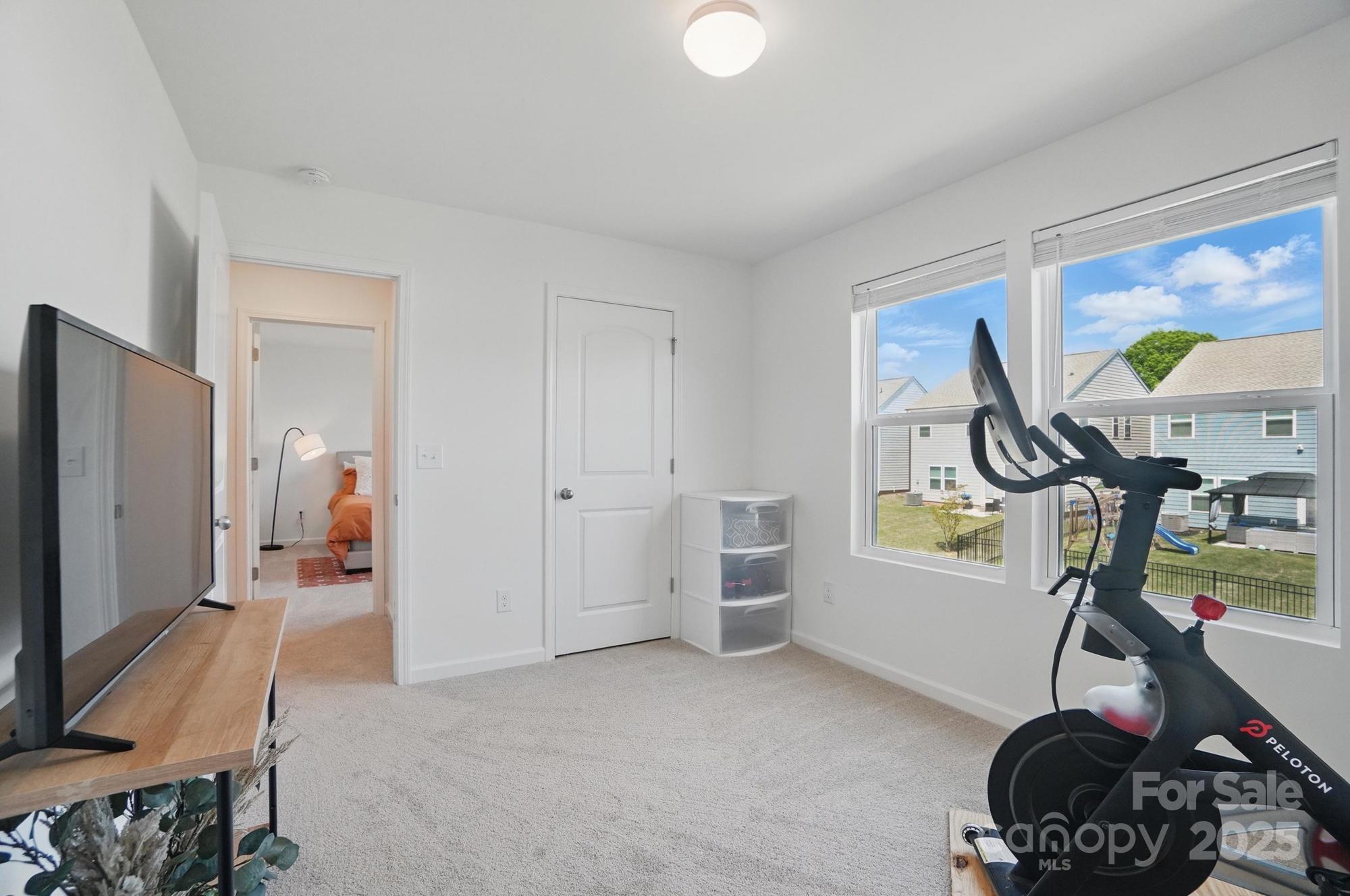 637 Scotch Meadows Loop Monroe, NC 28110 - Photo 23 of 30 a view of gym equipment and children play room