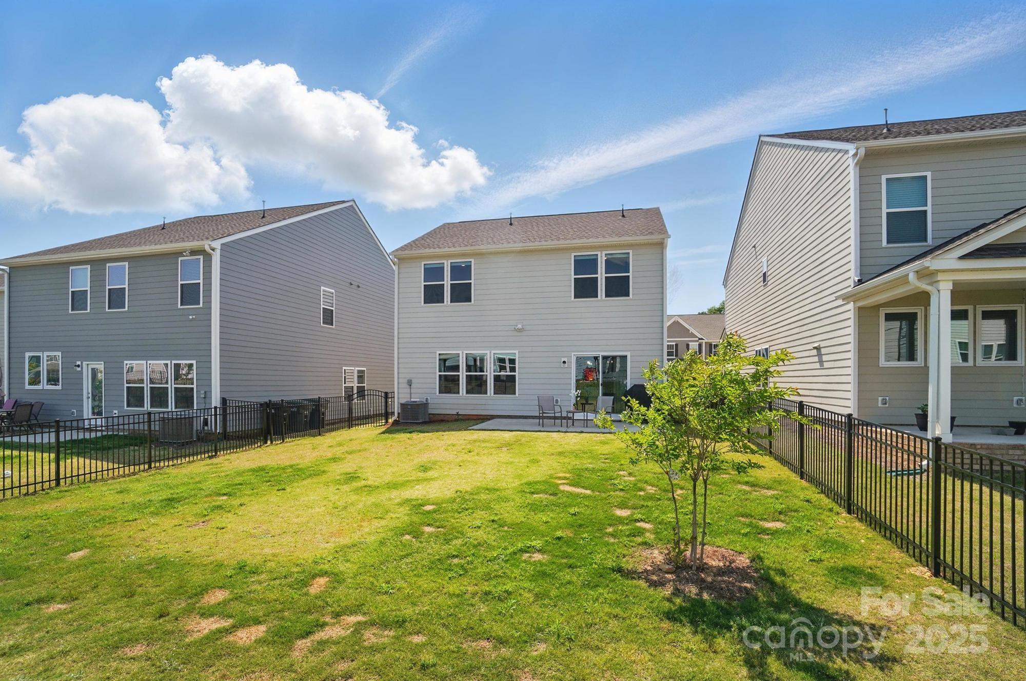 637 Scotch Meadows Loop Monroe, NC 28110 - Photo 28 of 30 a swimming pool with outdoor seating and yard
