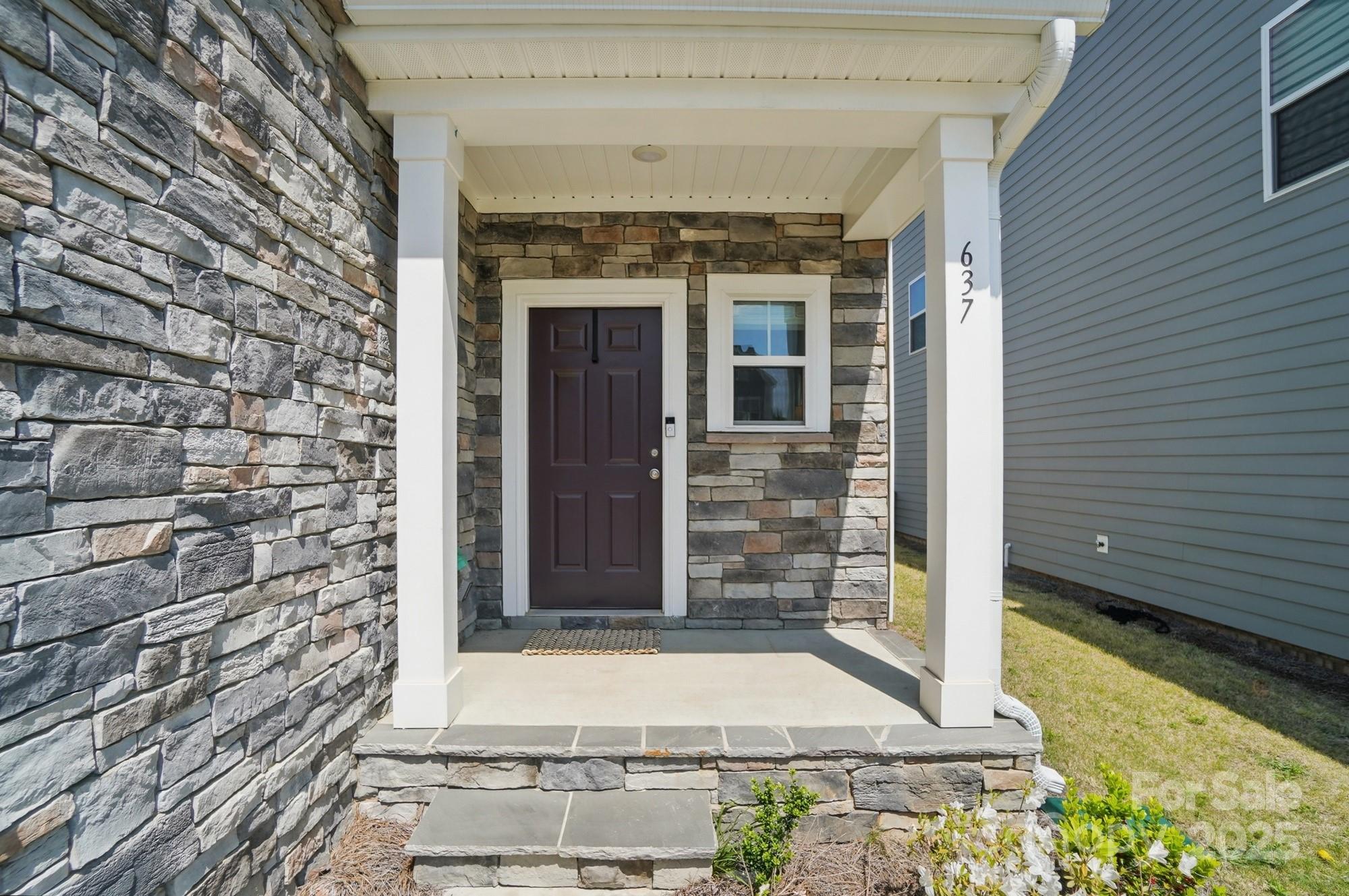 637 Scotch Meadows Loop Monroe, NC 28110 - Photo 3 of 30 a front view of a house with a porch