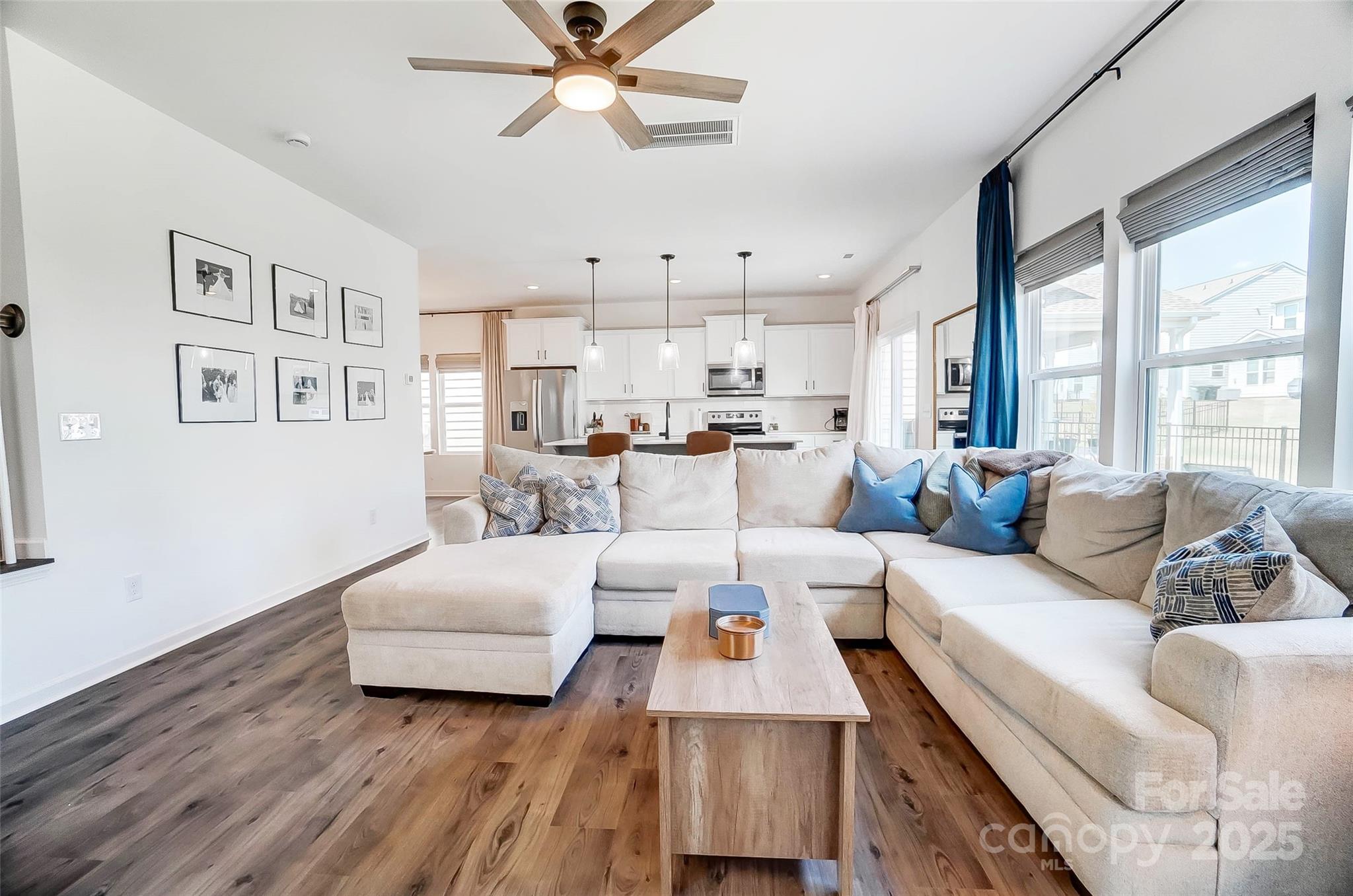 637 Scotch Meadows Loop Monroe, NC 28110 - Photo 6 of 30 a living room with furniture and a large window