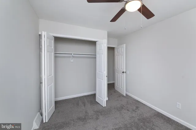 an empty room with a empty space and windows