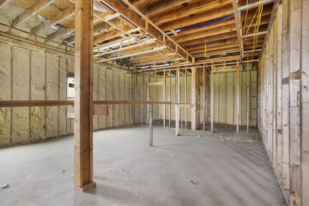 2463 County Road Bonham, TX 75418 - Photo 7 of 29 a view of an empty room with wooden walls