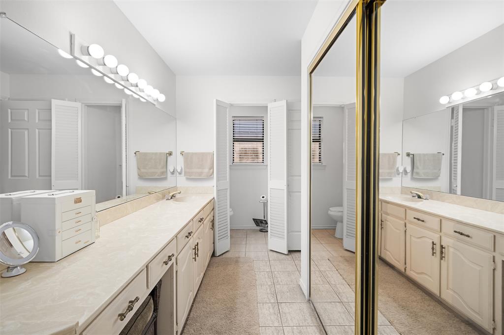 404 Laurel Trail North Terrell, TX 75160 - Photo 13 of 39 a spacious bathroom with a double vanity sink a mirror and a shower
