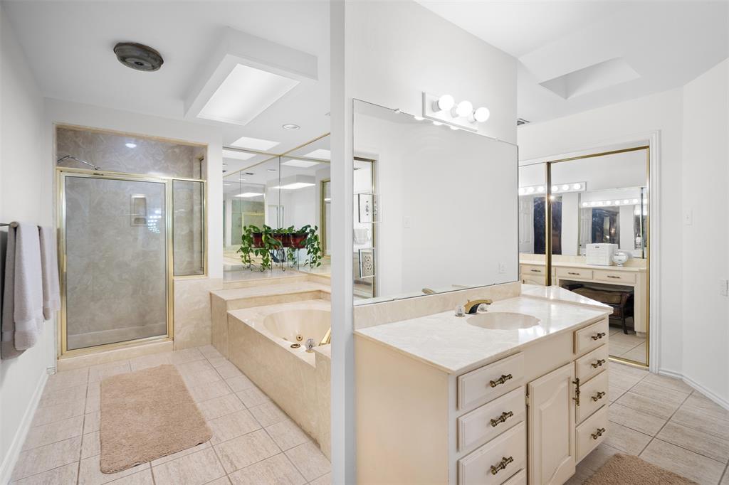404 Laurel Trail North Terrell, TX 75160 - Photo 16 of 39 a bathroom with a sink a large mirror and a shower