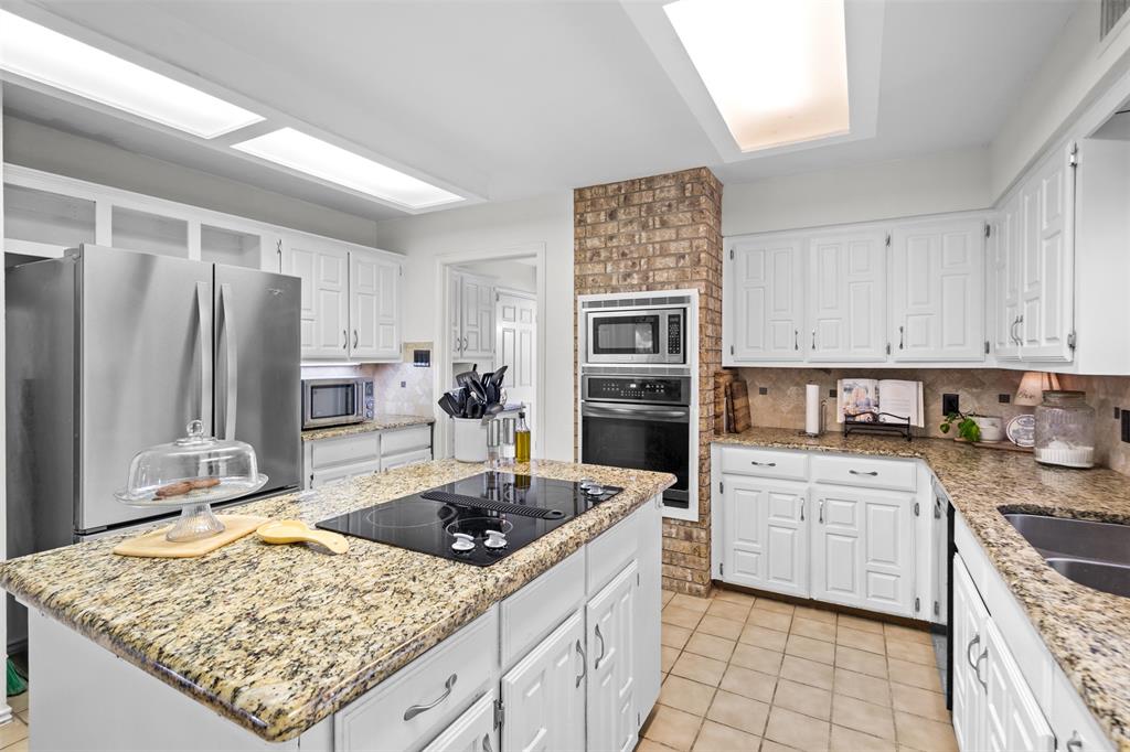 404 Laurel Trail North Terrell, TX 75160 - Photo 18 of 39 a kitchen with a sink stove and refrigerator