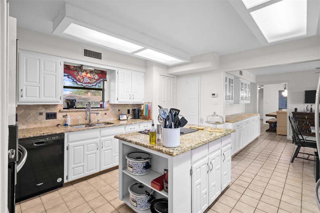 404 Laurel Trail North Terrell, TX 75160 - Photo 19 of 39 a open kitchen with stainless steel appliances granite countertop a stove and a sink