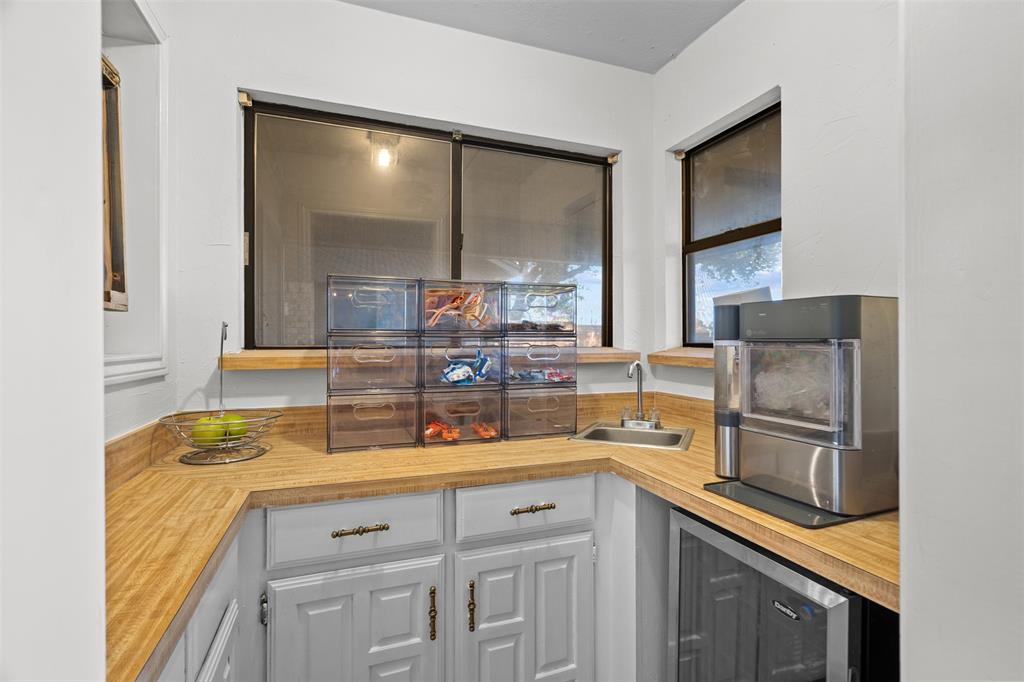 404 Laurel Trail North Terrell, TX 75160 - Photo 21 of 39 a kitchen with stainless steel appliances a sink and cabinets