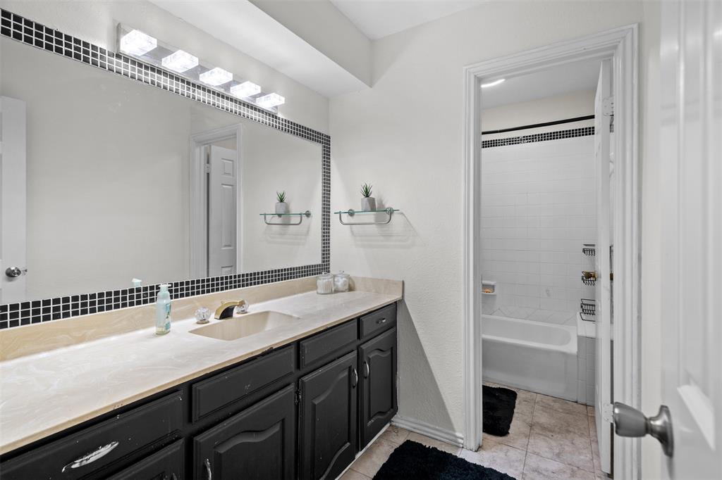 404 Laurel Trail North Terrell, TX 75160 - Photo 32 of 39 a bathroom with a double vanity sink a mirror and a shower