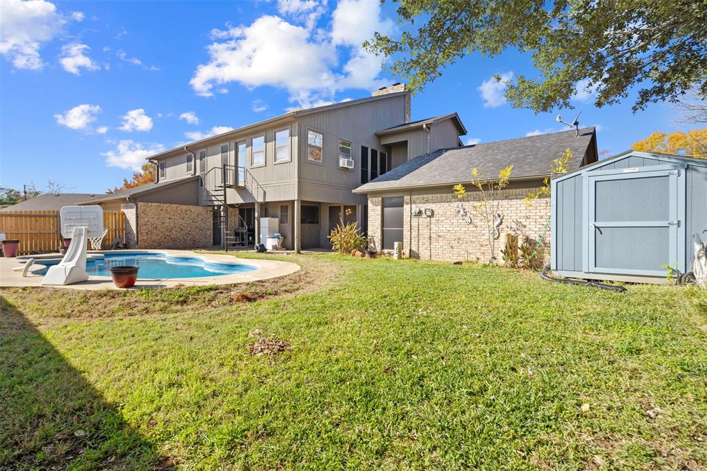 404 Laurel Trail North Terrell, TX 75160 - Photo 34 of 39 a view of a house with a backyard and a tree