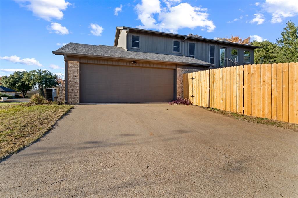 404 Laurel Trail North Terrell, TX 75160 - Photo 37 of 39 a front view of a house with a yard and garage