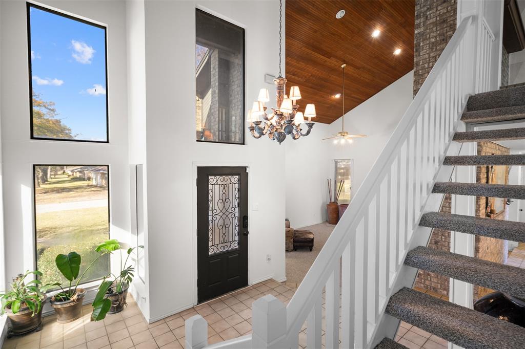 404 Laurel Trail North Terrell, TX 75160 - Photo 4 of 39 a view of a hallway with wooden floor and staircase