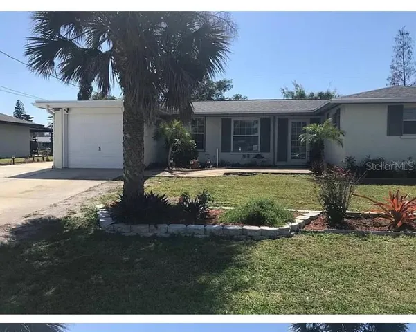 a kitchen with stainless steel appliances a refrigerator sink and cabinets