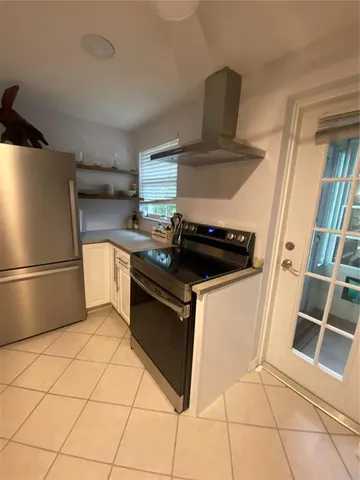 a view of a livingroom with furniture and a window