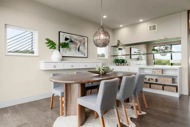 a view of a dining room with furniture window and outside view