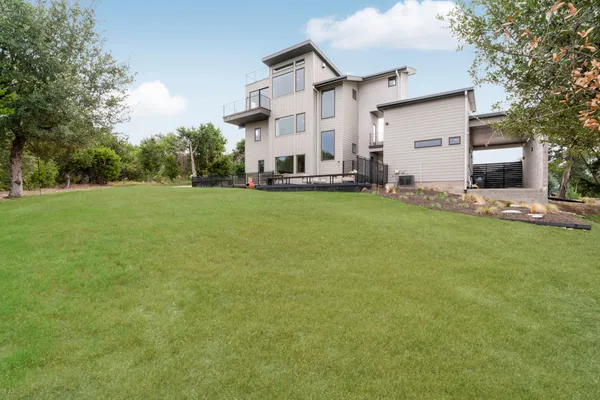 an aerial view of a house with a yard