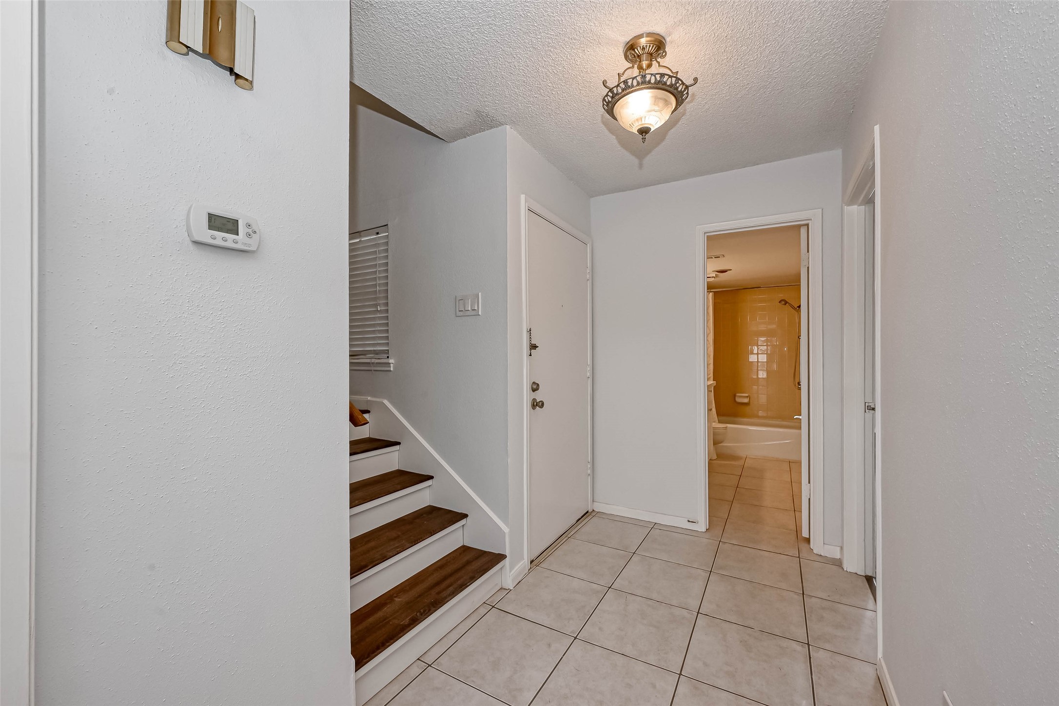14179 Misty Meadow Lane Houston, TX 77079 - Photo 10 of 41 a view of an entryway with a workspace