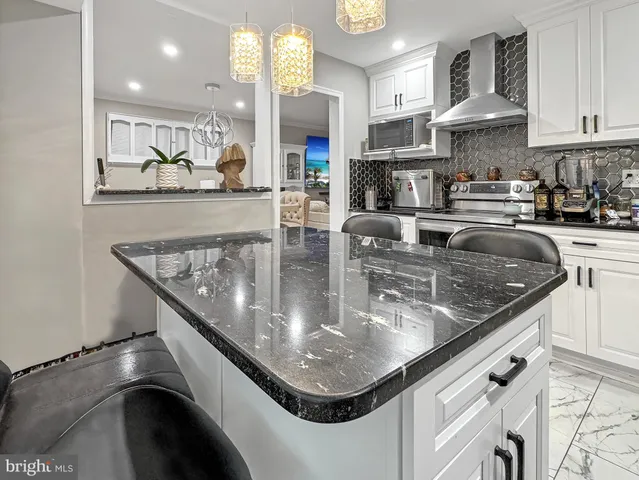 a bedroom with a bed and painting on the wall