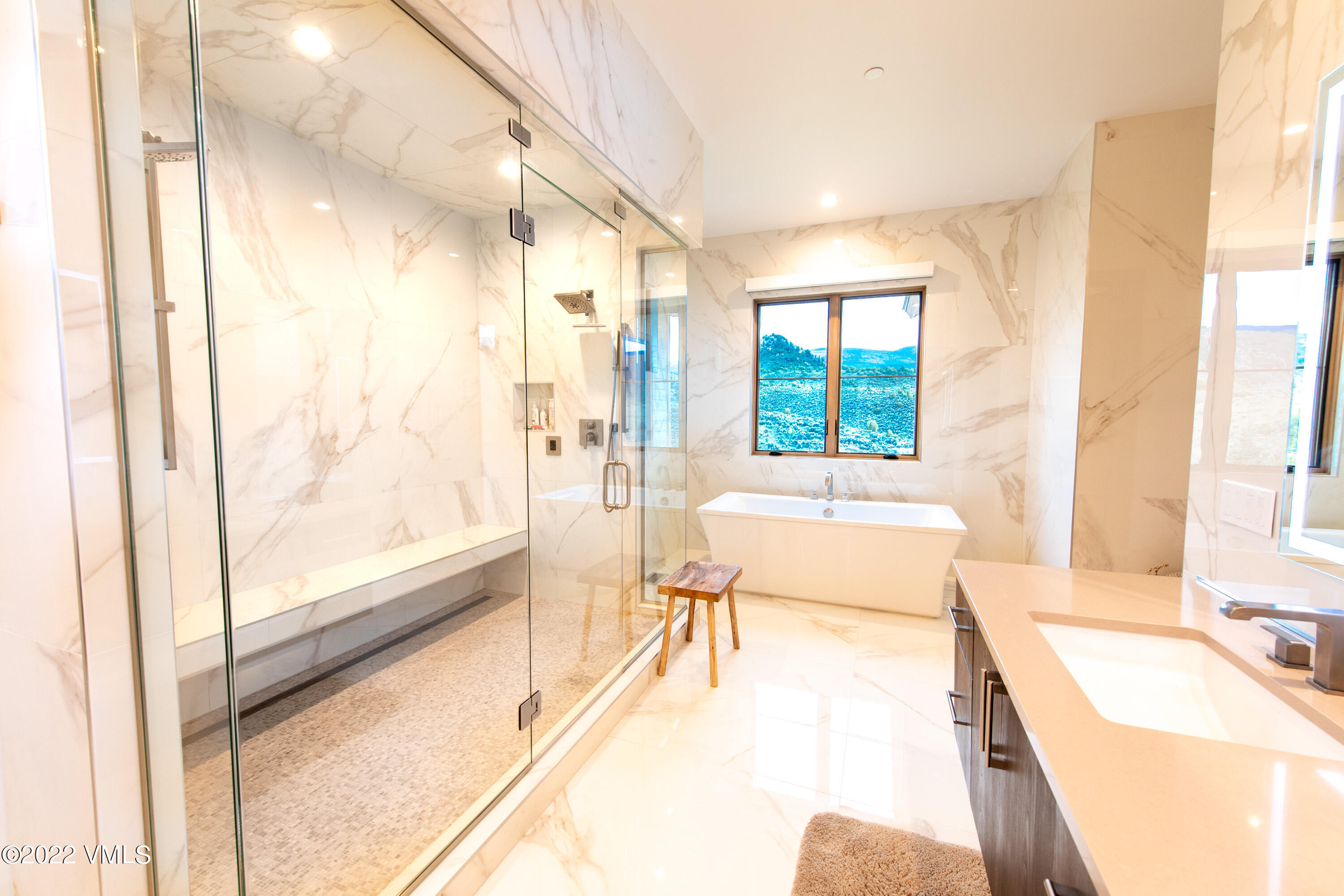2185 East Haystacker Drive Eagle, CO 81631 - Photo 15 of 30 a spacious bathroom with a tub double vanity and window