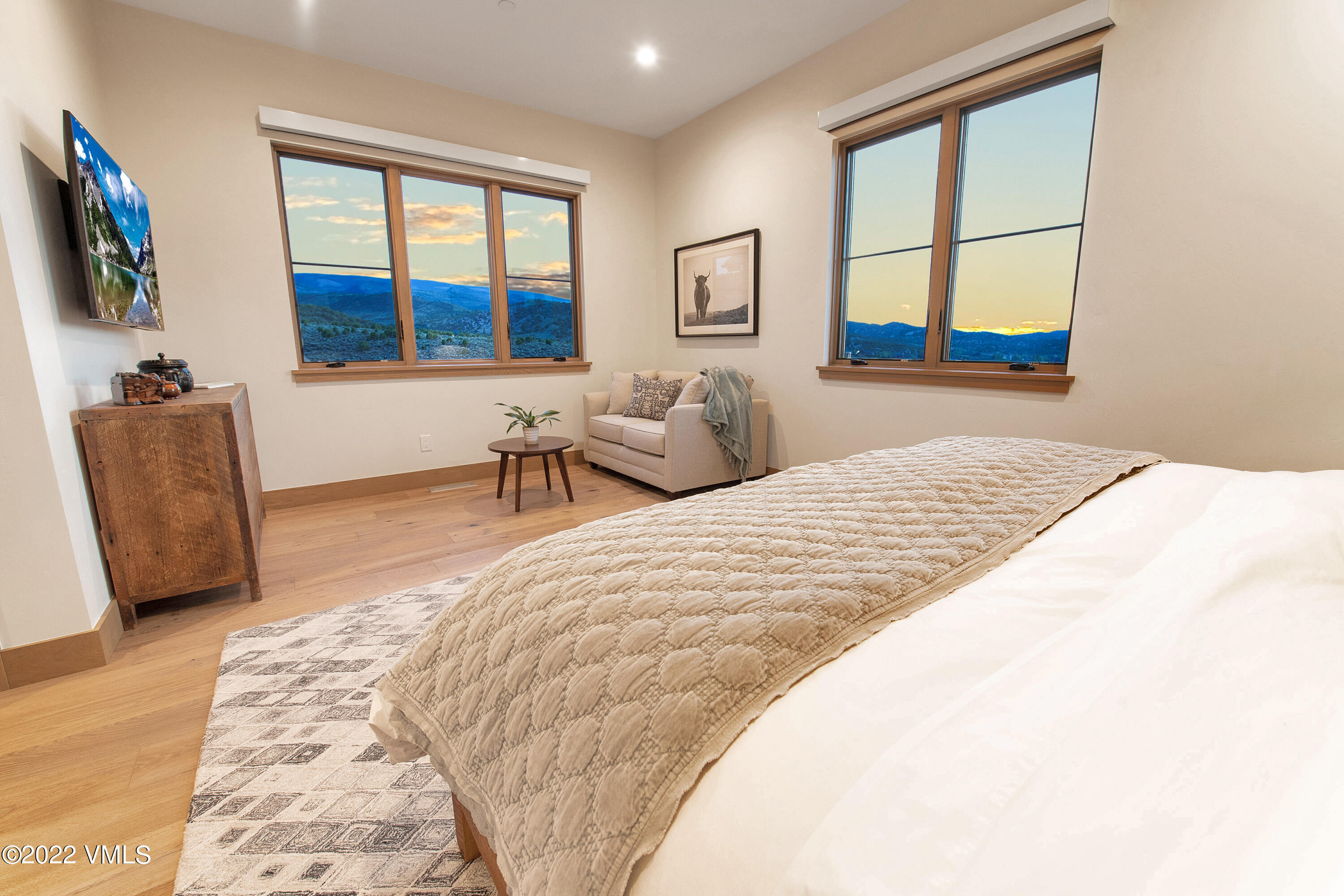 2185 East Haystacker Drive Eagle, CO 81631 - Photo 18 of 30 a bedroom with a large bed and a window