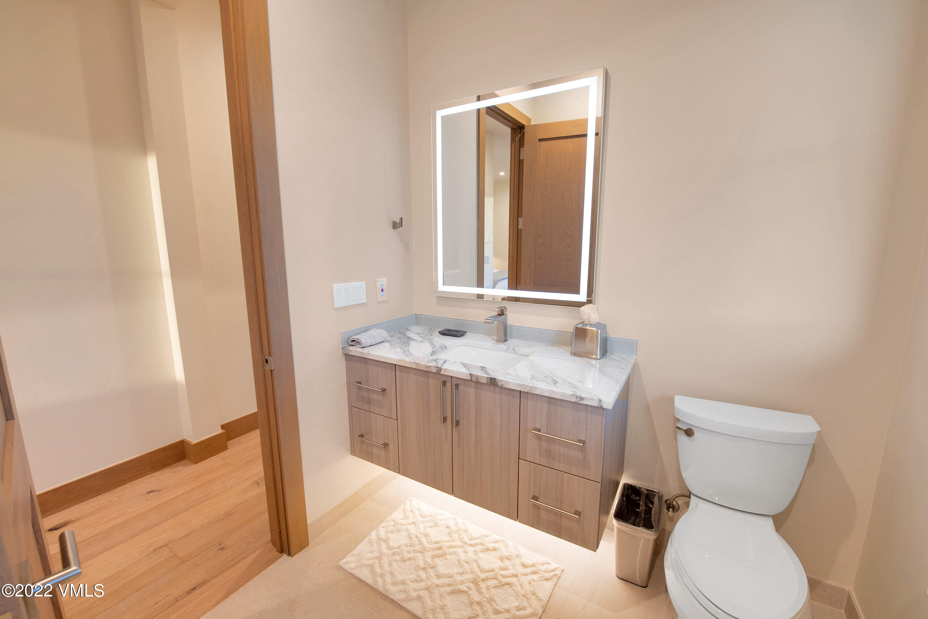 2185 East Haystacker Drive Eagle, CO 81631 - Photo 20 of 30 a bathroom with a granite countertop sink toilet and shower