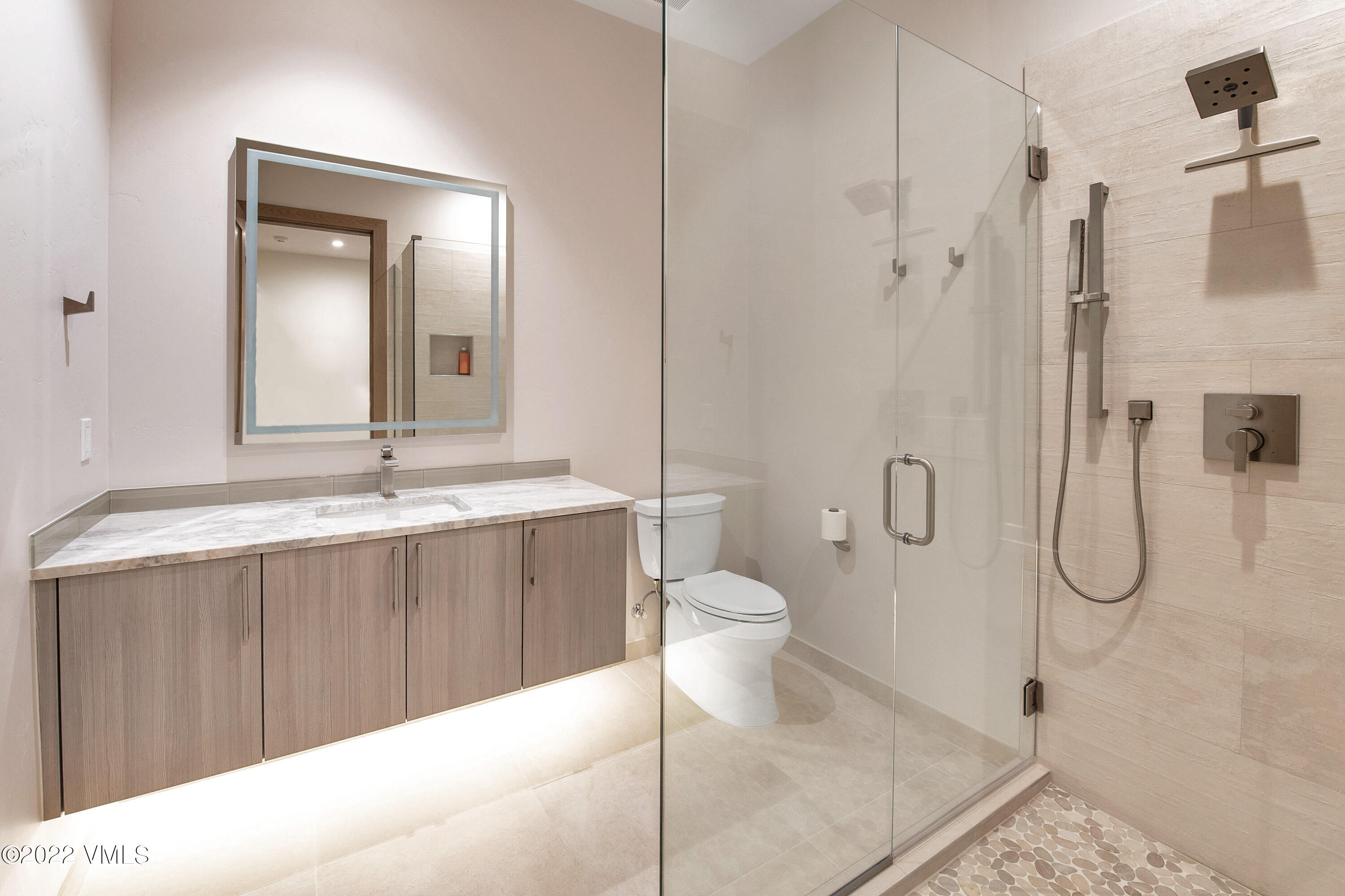 2185 East Haystacker Drive Eagle, CO 81631 - Photo 24 of 30 a bathroom with a sink a toilet and shower