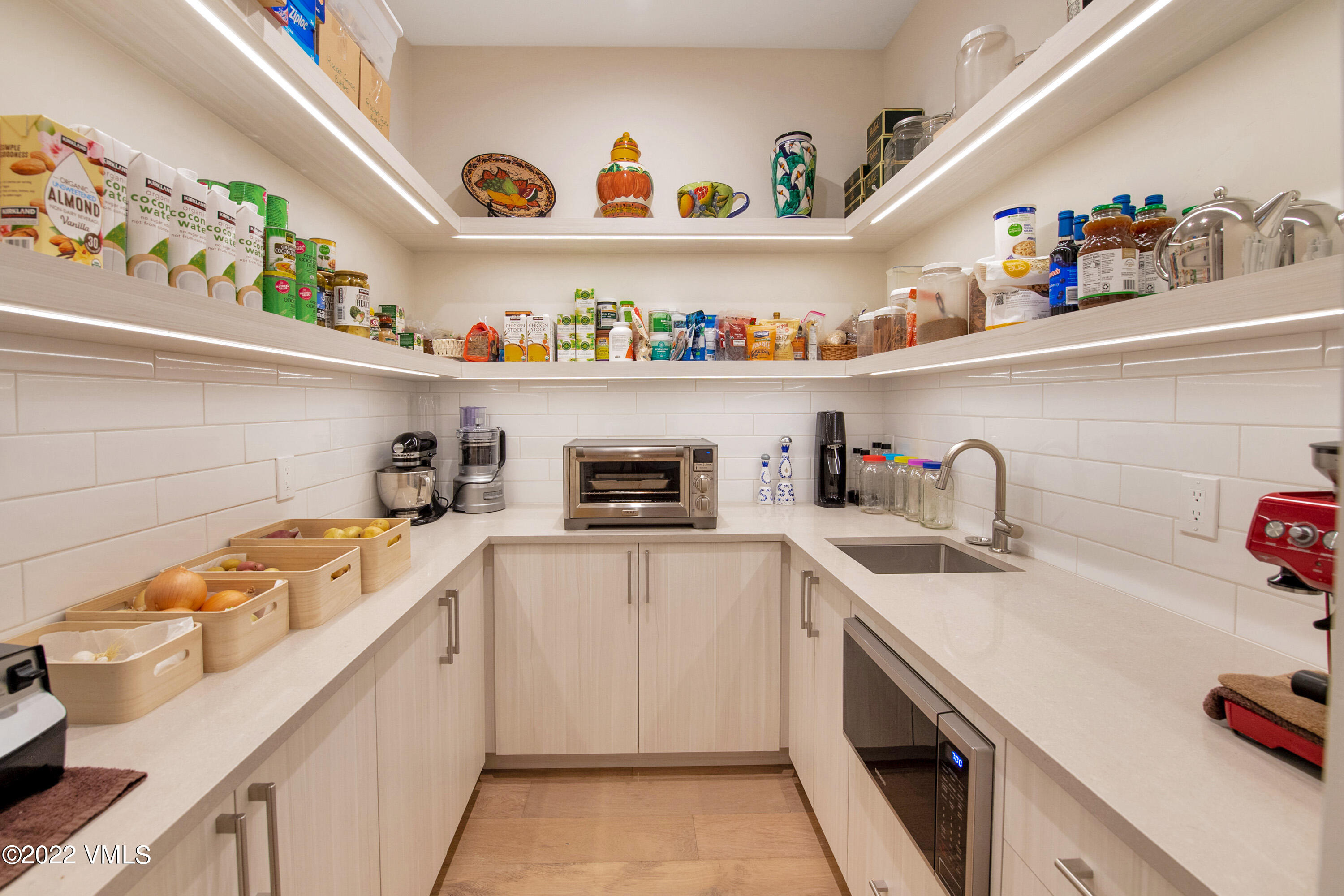2185 East Haystacker Drive Eagle, CO 81631 - Photo 27 of 30 a kitchen with a sink a stove and cabinets
