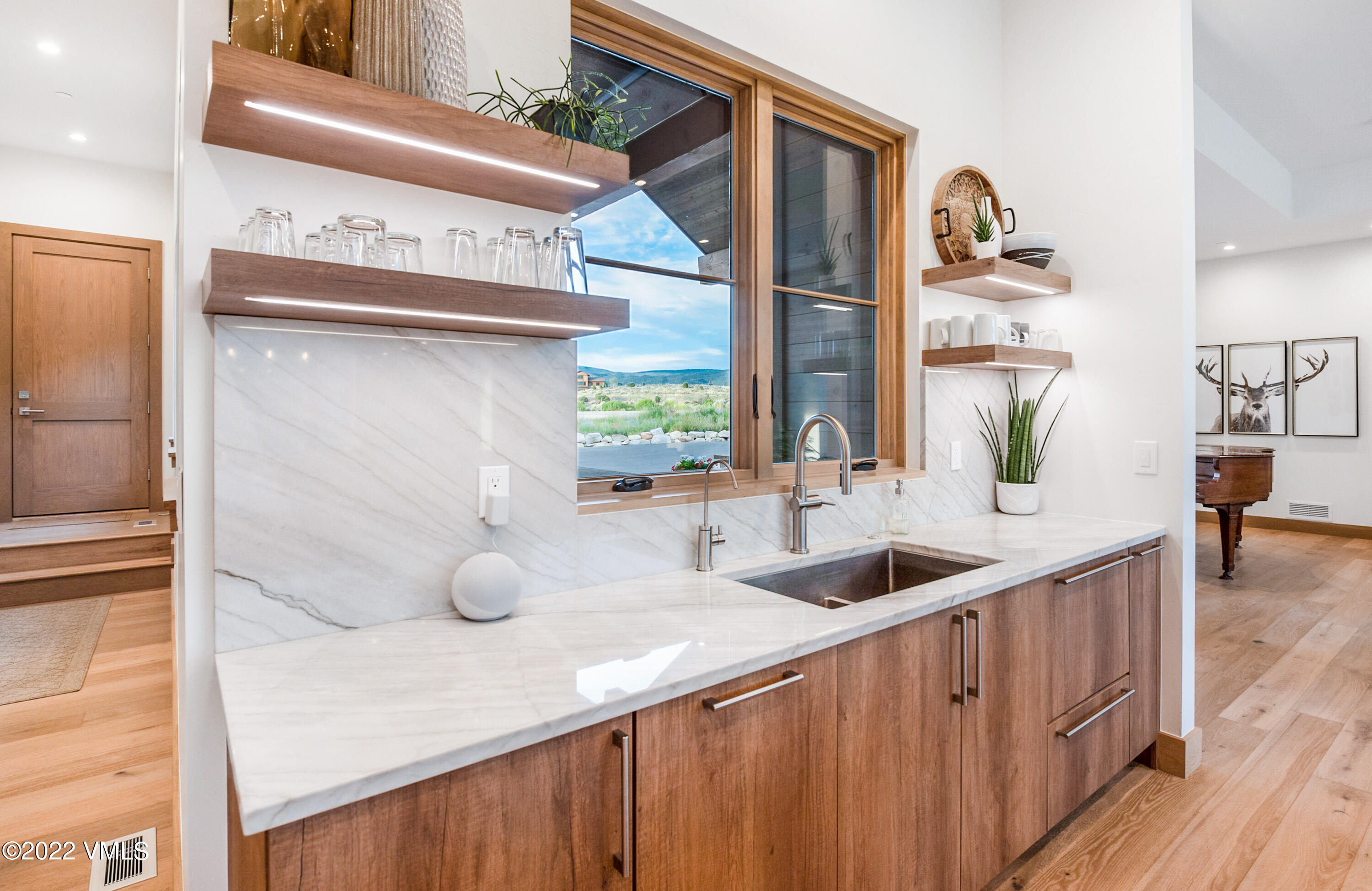 2185 East Haystacker Drive Eagle, CO 81631 - Photo 8 of 30 a kitchen with a sink and a wooden floor