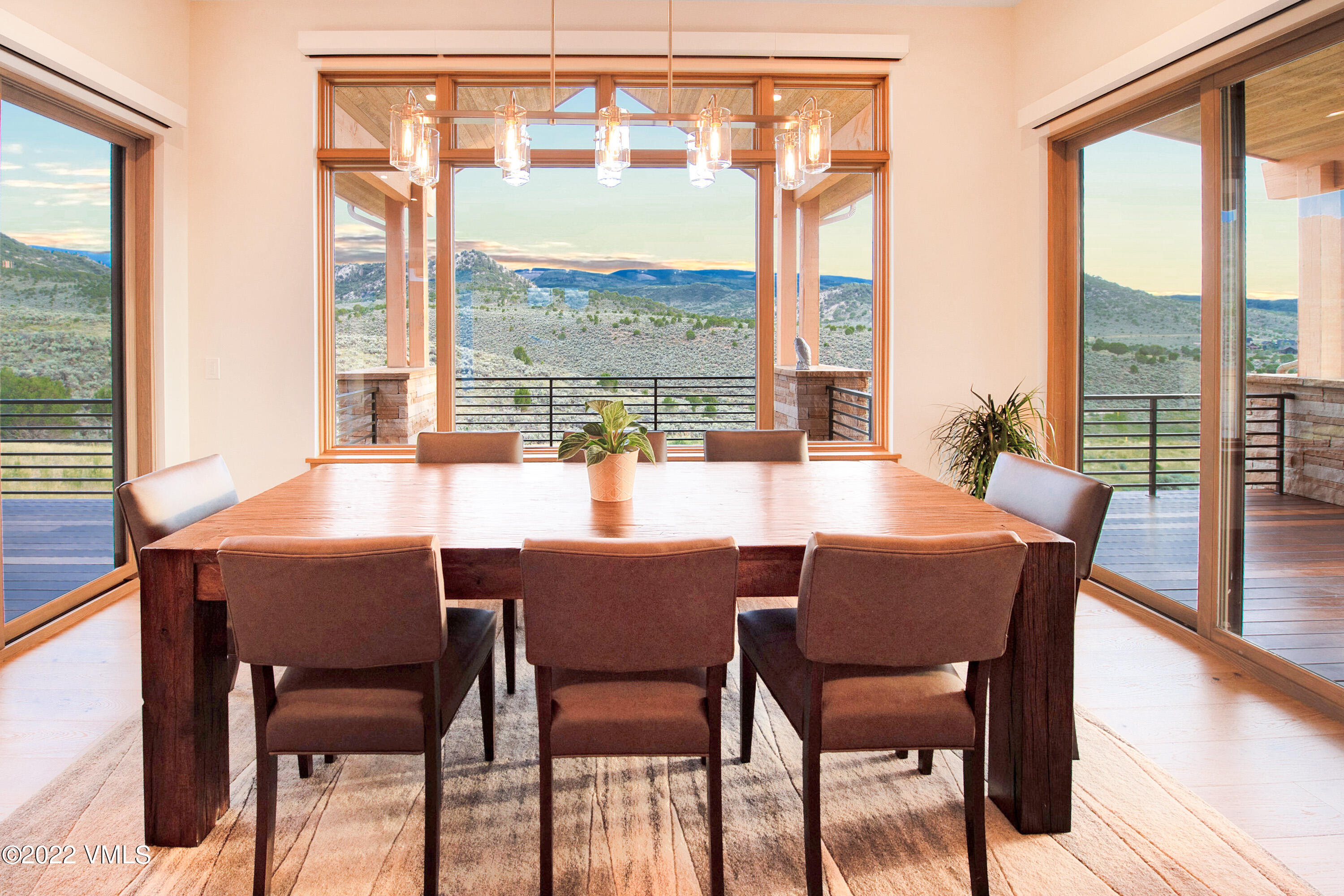 2185 East Haystacker Drive Eagle, CO 81631 - Photo 9 of 30 a dining room with furniture a chandelier and wooden floor