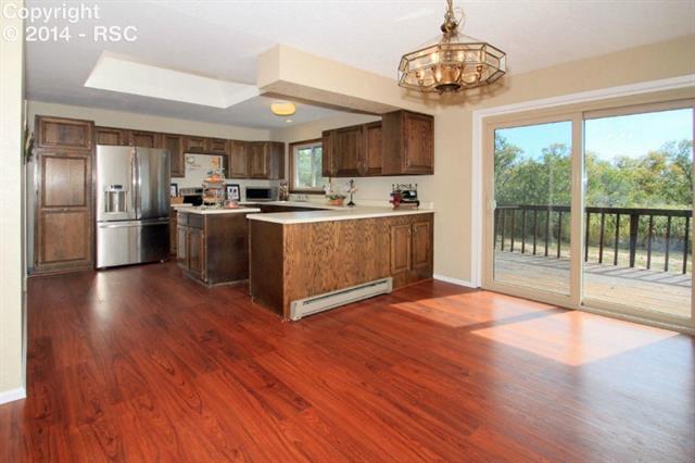 18790 Spring Valley Road Monument, CO 80132 - Photo 5 of 23 view of the kitchen from the dining area