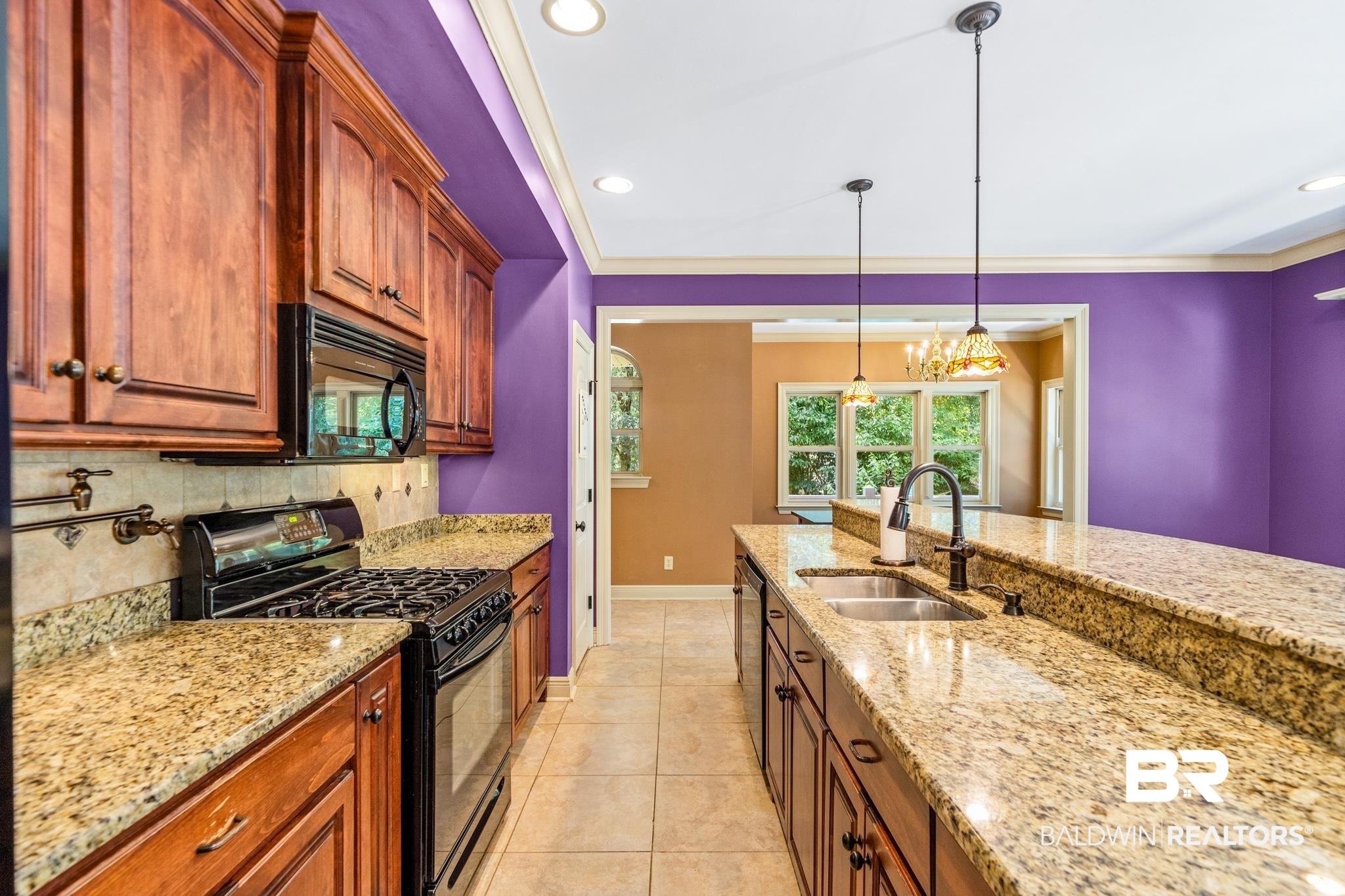 8321 Dixon Road Bay Minette, AL 36507 - Photo 27 of 79 Kitchen featuring decorative backsplash, light stone countertops, sink, light tile patterned flooring, and black appliances