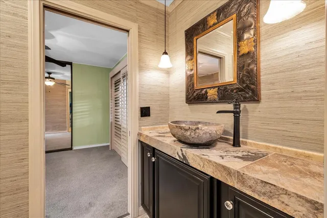 a view of a storage and utility room with a sink