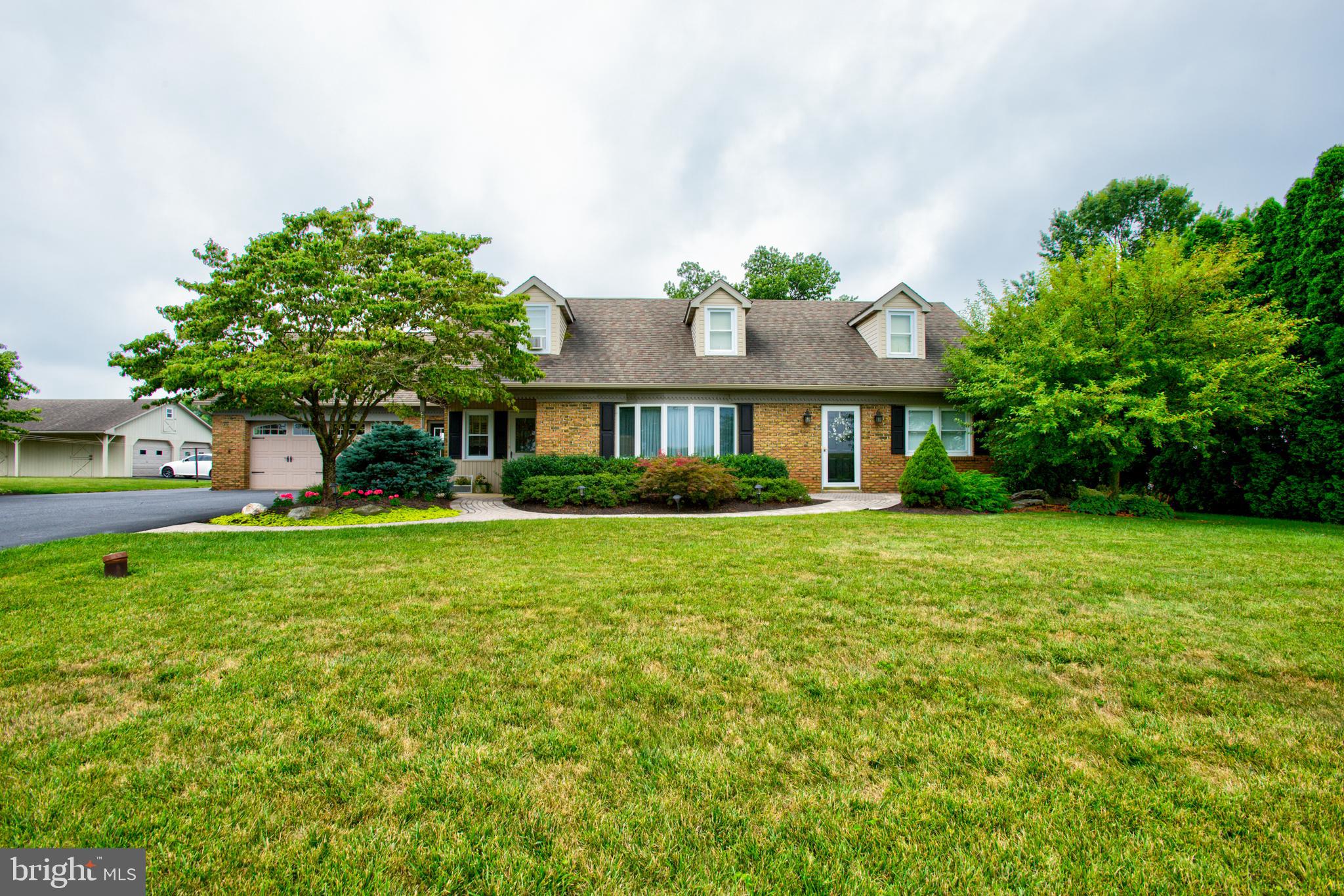 116 Meetinghouse Road Gap, PA 17527 - Photo 20 of 66 a front view of a house with a garden