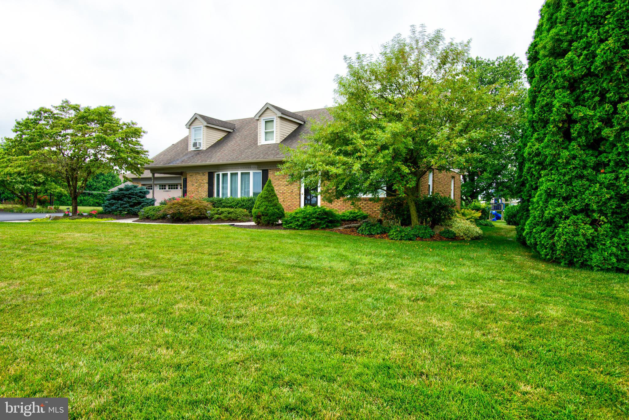 116 Meetinghouse Road Gap, PA 17527 - Photo 21 of 66 a view of house in front of a big yard with plants and large trees