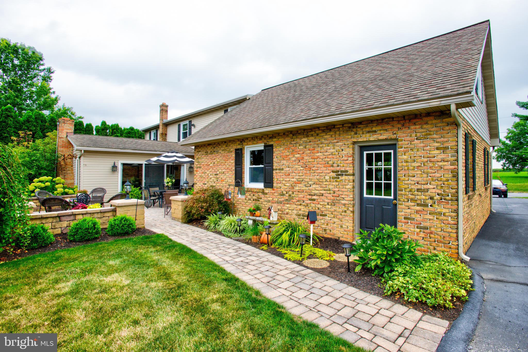 116 Meetinghouse Road Gap, PA 17527 - Photo 26 of 66 a front view of house with a garden and patio