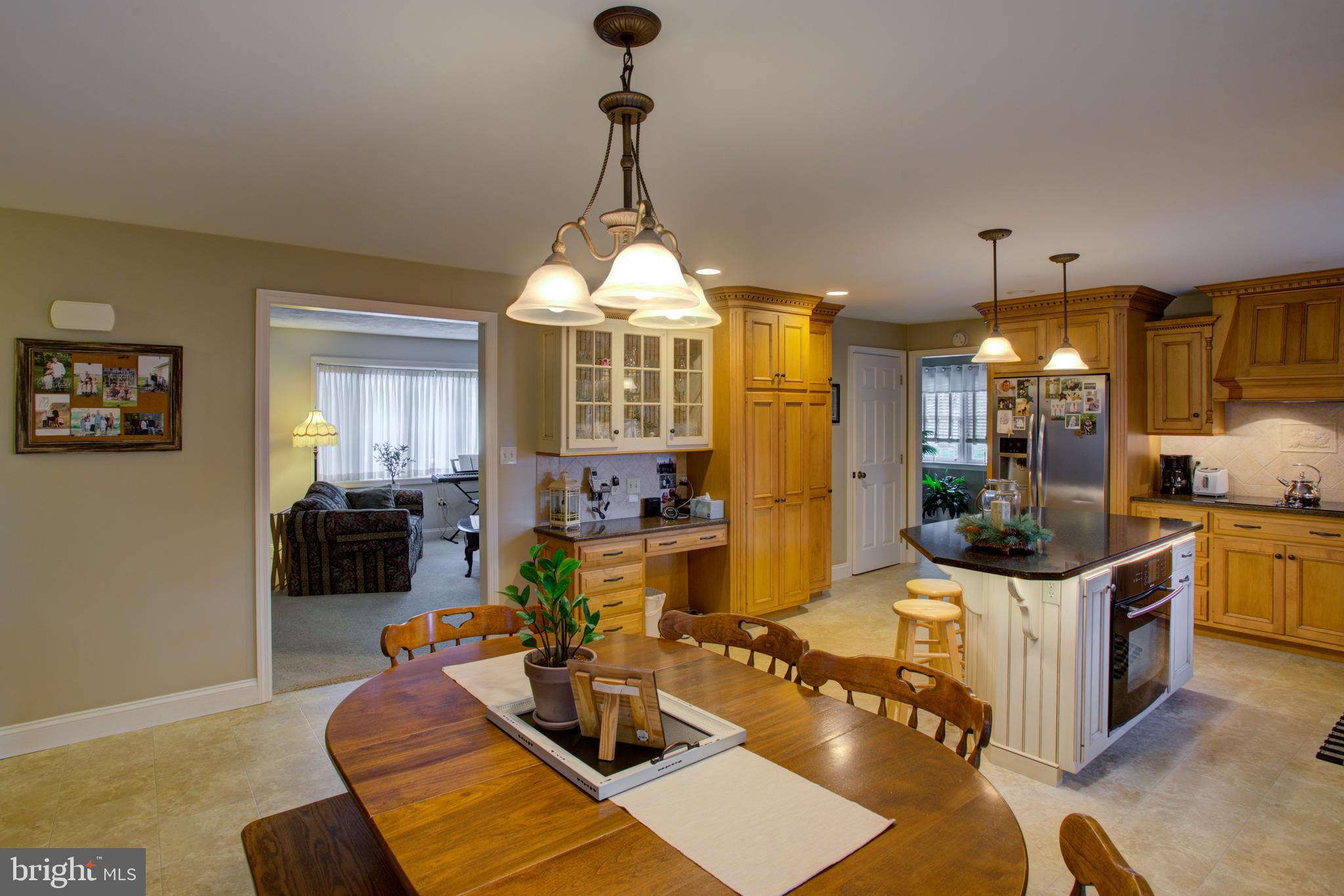 116 Meetinghouse Road Gap, PA 17527 - Photo 35 of 66 a view of a dining room and livingroom with furniture wooden floor a chandelier