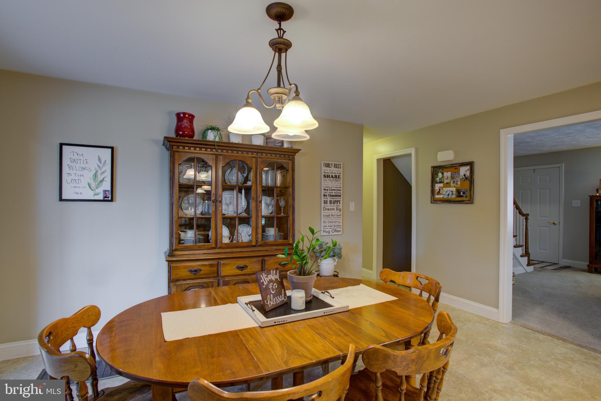 116 Meetinghouse Road Gap, PA 17527 - Photo 36 of 66 a view of a dining room with furniture wooden floor and a chandelier