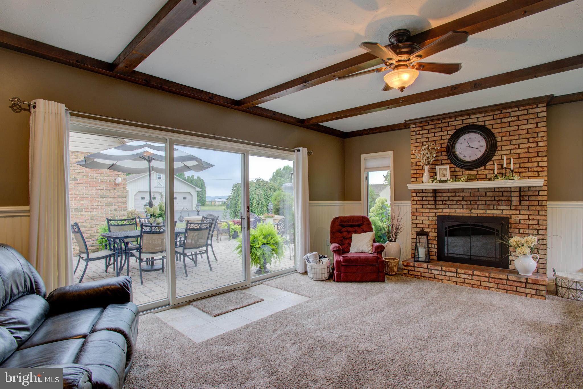116 Meetinghouse Road Gap, PA 17527 - Photo 38 of 66 a living room with furniture a fireplace and a large window