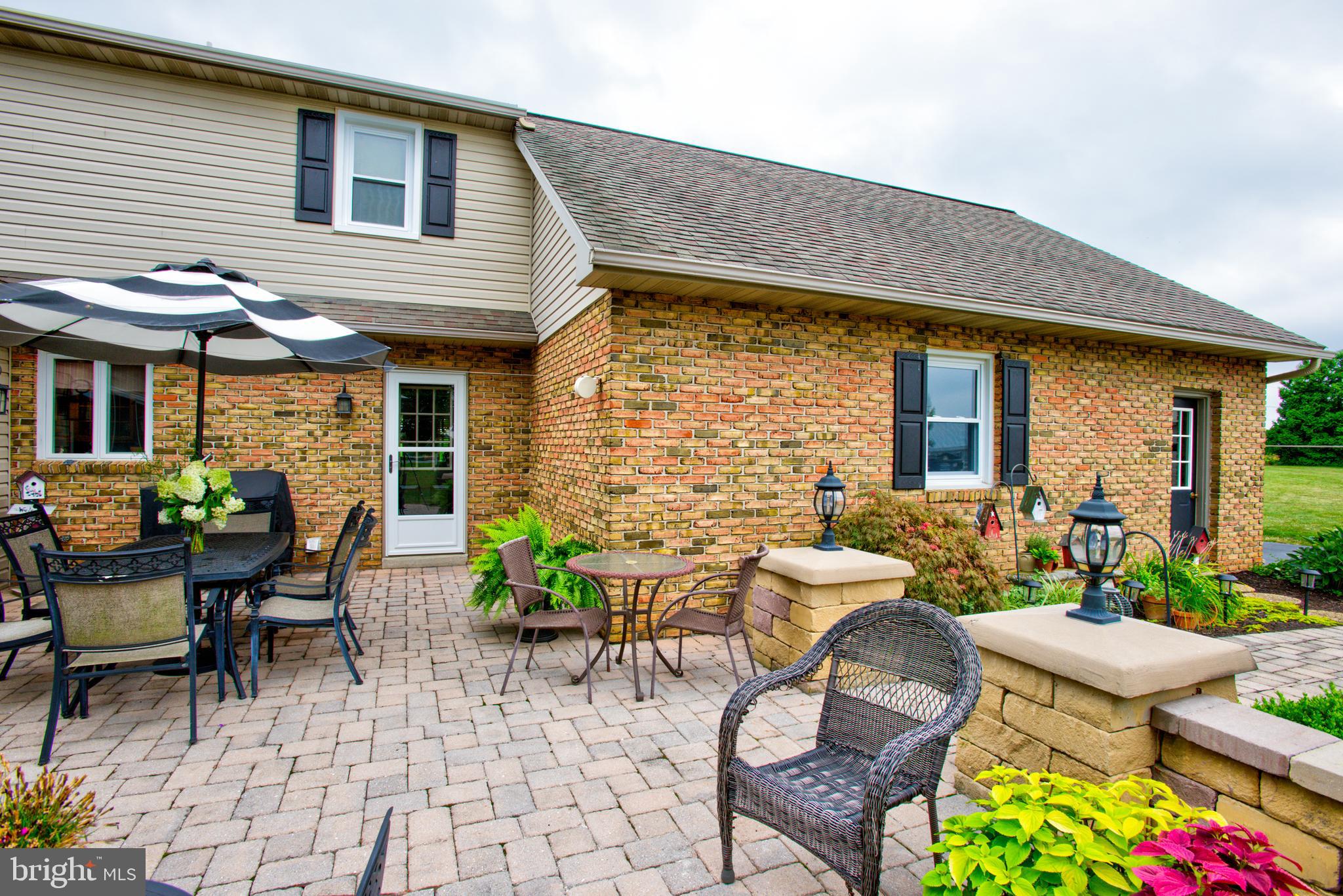 116 Meetinghouse Road Gap, PA 17527 - Photo 5 of 66 a view of a patio with table and chairs and potted plants
