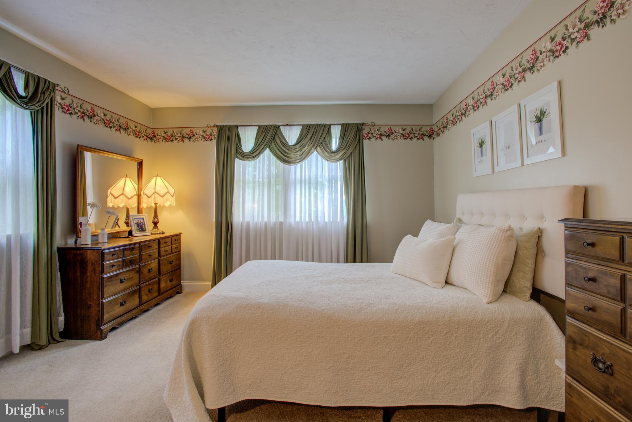116 Meetinghouse Road Gap, PA 17527 - Photo 49 of 66 a bedroom with a large bed and dresser with mirror
