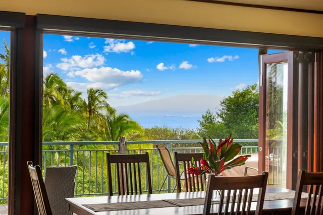 a view of a chairs and table in patio