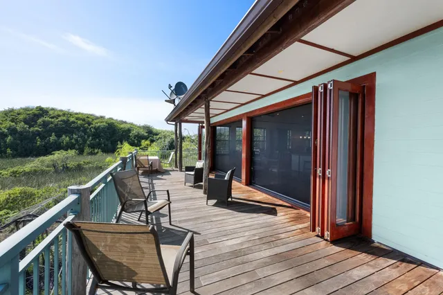 a balcony with furniture and city view